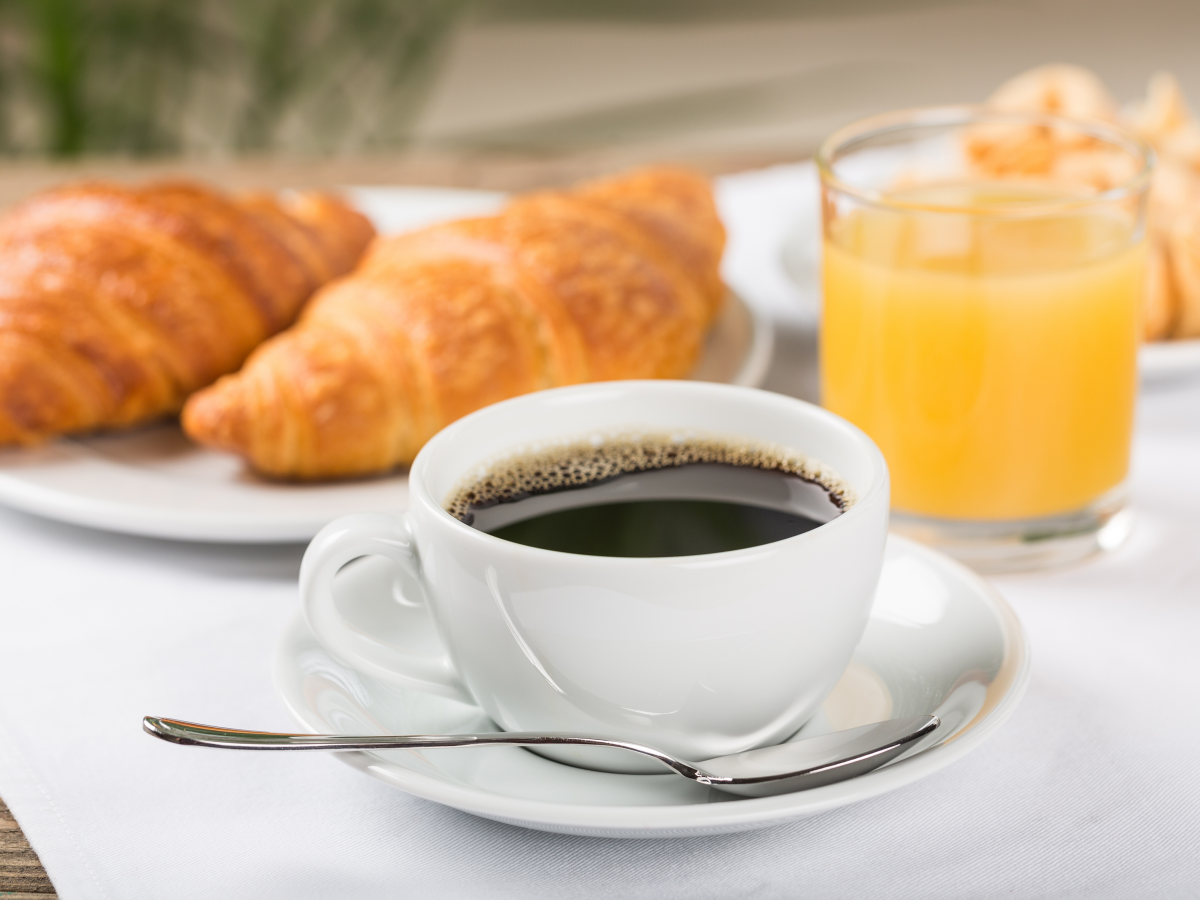 coffee, orange juice, and croissant