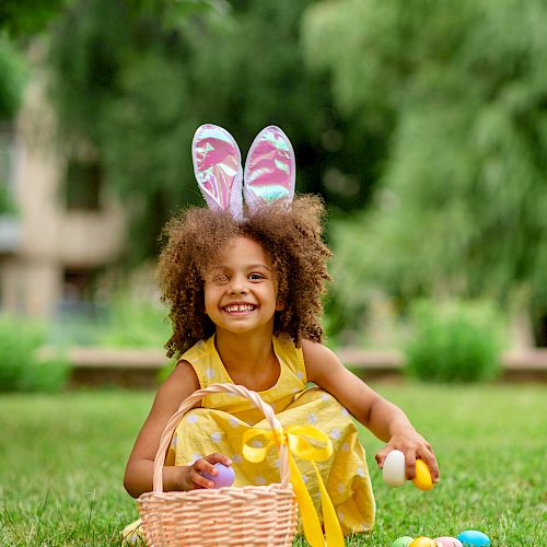 Little girl with bunny ears and Easter basket