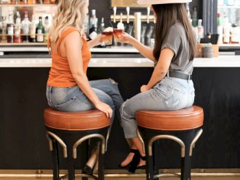 two girls at bar sitting