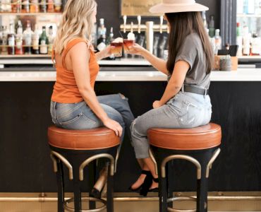 two girls at bar sitting